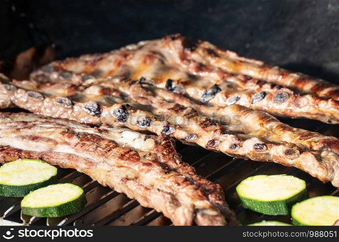 Barbecue grill with grilled pork ribs. Spanish churrasco