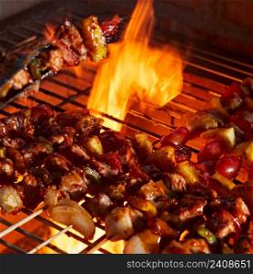 barbecue grill with smoke and flames in the kitchen. barbecue grill with smoke and flames