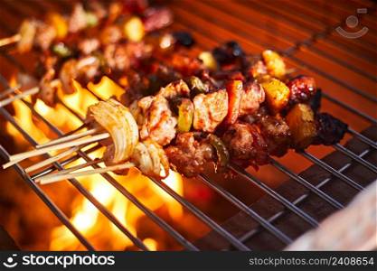 barbecue grill with smoke and flames in the kitchen. barbecue grill with smoke and flames