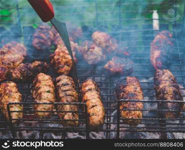 Barbecue grilling shish kebab. Clos up view. Grill, Frying Fresh Meat, Chicken Barbecue, Sausage concept.