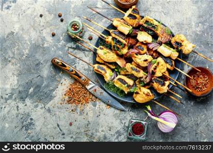 Barbecue of chicken on skewers with onion.Grilled meat skewers. Grilled meat on skewers