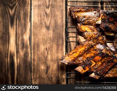 Barbecue pork ribs. On a wooden table.. Barbecue pork ribs.