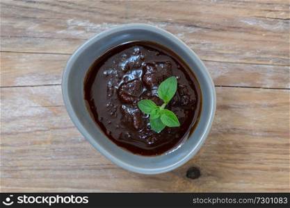 barbecue sauce dip macro on wood background.. barbecue sauce dip macro on wood background