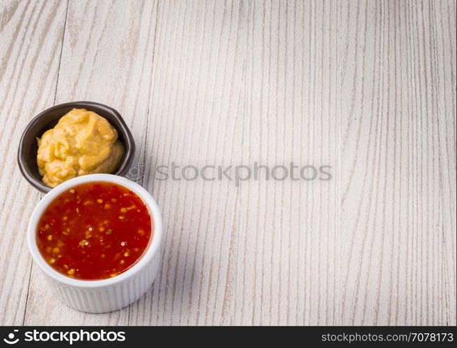 Barbecue sauce over rustic barn wood table with room for copy space.