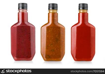 barbecue sauces in bottles on white background
