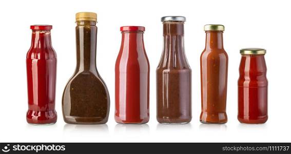 barbecue sauces in glass bottles on white background