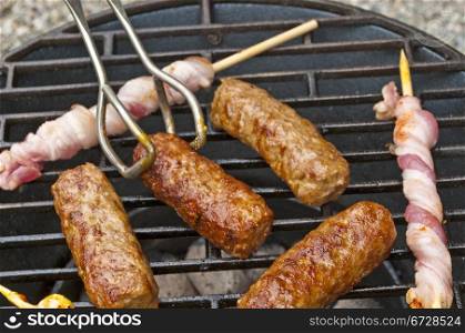 barbecue with cevapi and ham