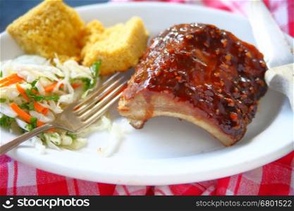 Barbecued baby back ribs with coleslaw and cornbread