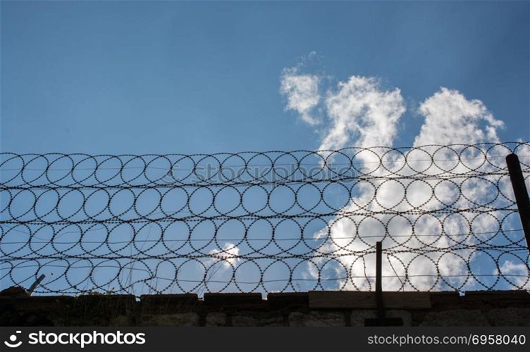 barbed fence for protection purposes . barbed wire fence used for protection purposes