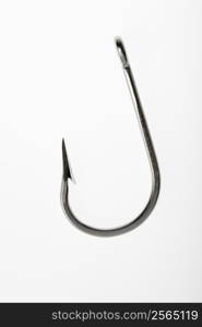 Barbed fishing hook against white background.