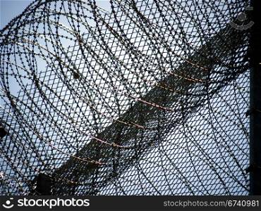 Barbed wire fence. Barbed wire fence at a prison