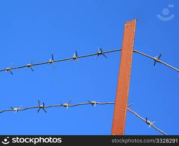 barbed wire on blue background