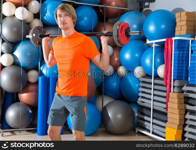 barbell squats blond man at gym exercise workout