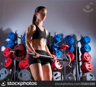 Barbell woman workout fitness club at weightlifting gym