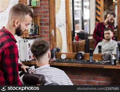 barber showing haircut customer