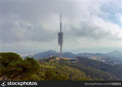 Barcelona. A television tower in the park of Collserola.. A television communications tower on Mount Tibidabo. Barcelona. Spain.