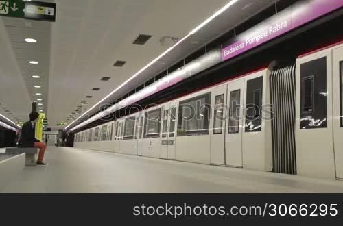 BARCELONA - AUGUST 12, 2012: Time lapse subway and passengers at Barcelona&acute;s underground (Badalona station)