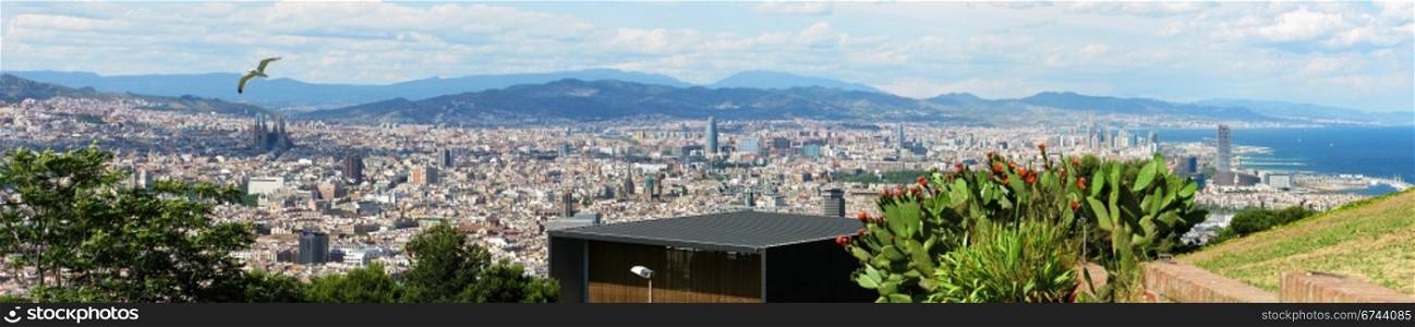 Barcelona Cityscape. Panorama view of Barcelona from montjuic with sea and mountains