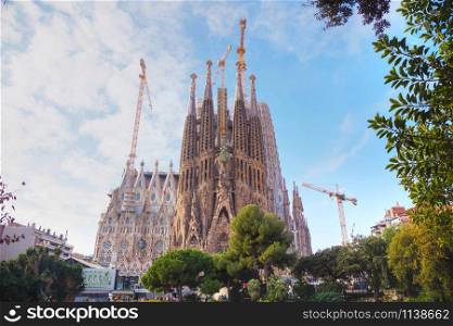BARCELONA - DECEMBER 12: Overview with Sagrada Familia basilica with touristd on December 12, 2018 in Barcelona, Spain.