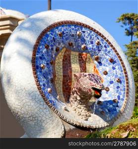 Barcelona Park Guell of Gaudi Snake and four Catalan bars in modernism mosaic