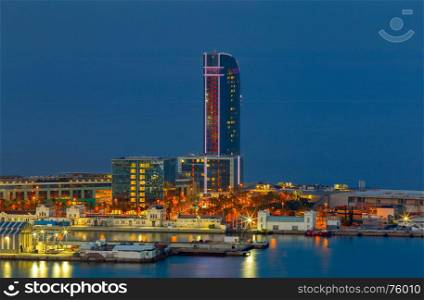 Barcelona. Seaport at night.. View of the seaport and the city embankment at night. Barcelona. Spain.