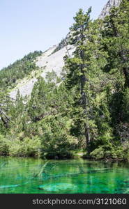 Bardonecchia, Italy. The Green Lake, Alpine lake with fluo color due to a local seaweed