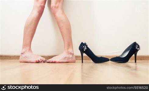 Bare legs and shoes near in a same position