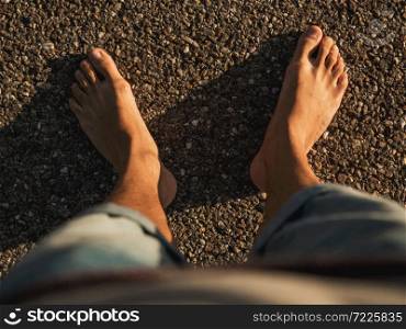 Barefoot feeling the hot road