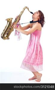 Barefoot girl playing jazz on a tenor saxophone against a white background.