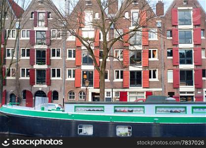 Barge and buildings near the Amstel canal in Amsterdam, Netherlands