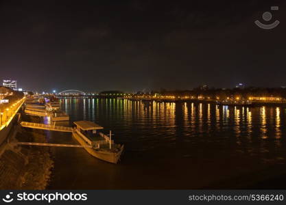 Barge and night lights on the Dunai in Bratislava, Slovakia&#xA;