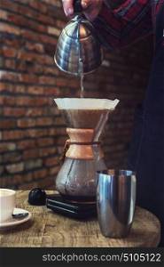 Barista brewing coffee in the cafe. Barista brewing coffee
