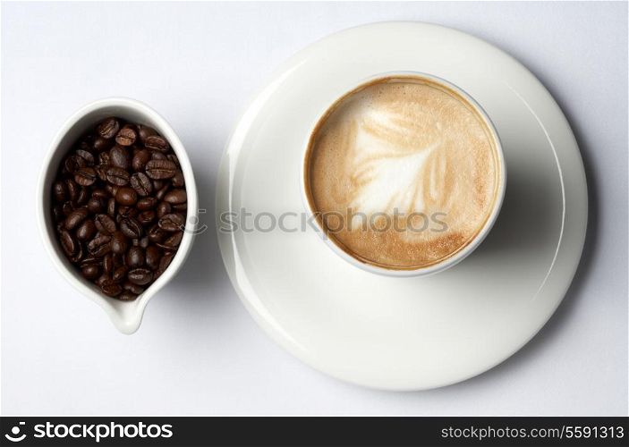 barista coffee cup and colombian coffee beans
