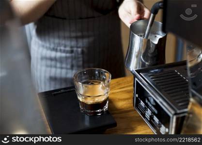 barista hand steaming milk making latte coffee caf