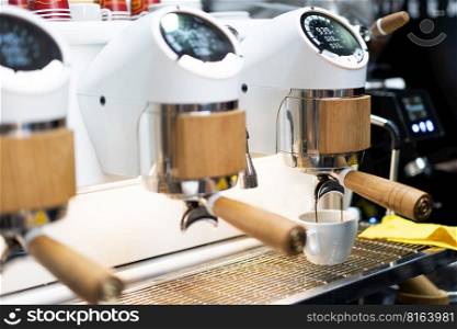 barista makes coffee in a coffee machine 