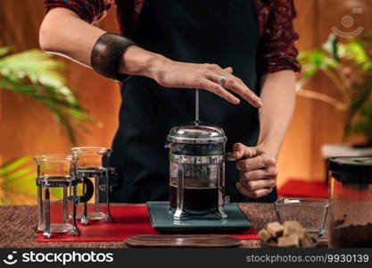 Barista Making French Press Coffee. Close up image of hands female barista making French press coffee 