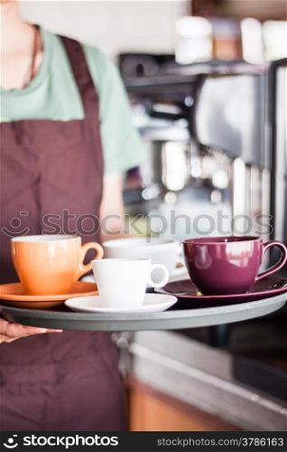 Barista serving set of freshly brewed coffee, stock photo
