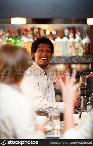 Barista taking orders at coffee shop