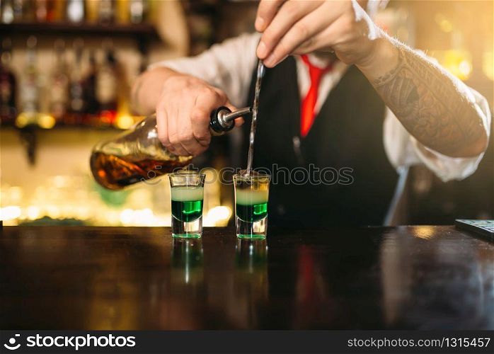 Barman making attractive alcoholic cocktail. Alcohol beverage preparation