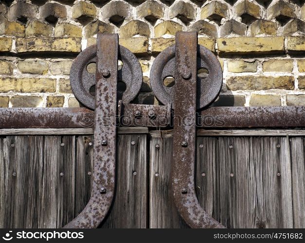 Barn Door-Sliders. Detail of an old barn door with glides