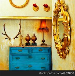 baroque grunge vintage house with blue drawer and golden mirror