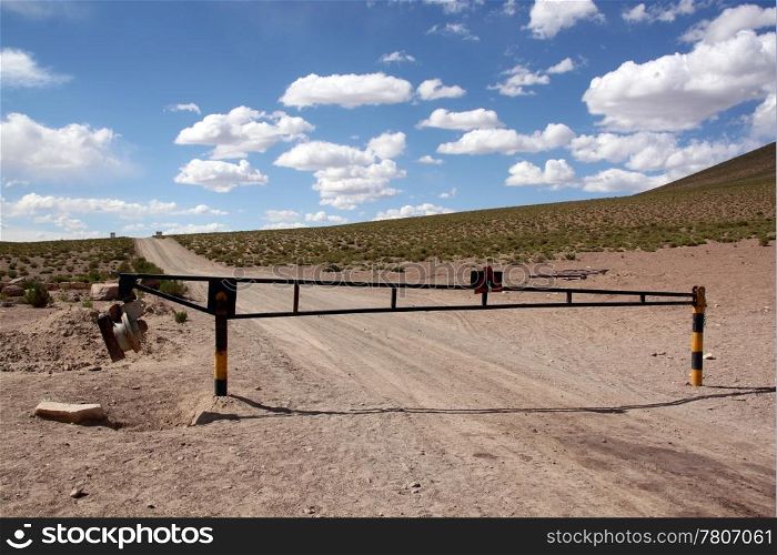 Barrier on the desert roasd near Uyuni, Bolivia