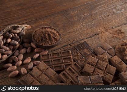 Bars Chocolate , candy sweet, dessert food on wooden background. Dark and milk chocolate bar on a wooden table