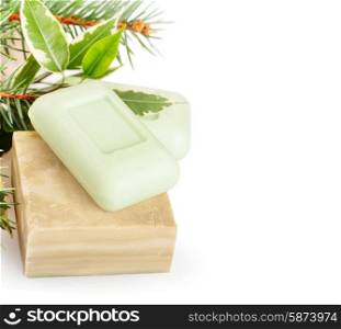 Bars of natural herbal handmade soap on a white background