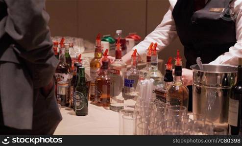 Bartender makes a drink at a conference