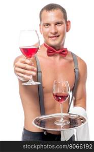 bartender, with a naked torso gives a glass of red wine