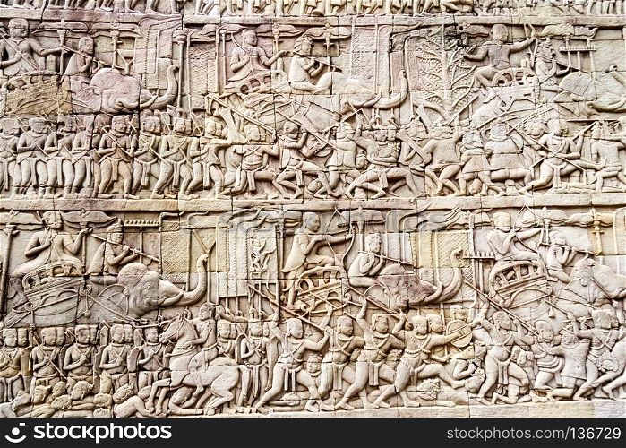 Bas relief depicting a battle, Bayon Buddhist temple at Angkor Thom, Siem Reap, Cambodia