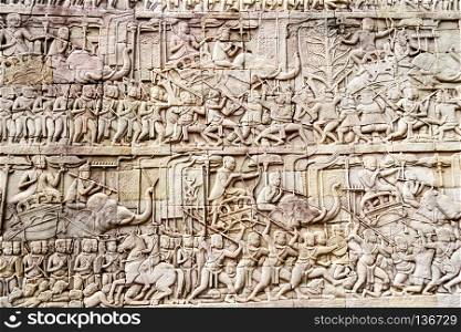 Bas relief depicting a battle, Bayon Buddhist temple at Angkor Thom, Siem Reap, Cambodia
