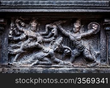 Bas relief depicting Durga slaying demon (Maheeshasuramardini). Brihadishwara Temple. Tanjore (Thanjavur), Tamil Nadu, India. The Greatest of Great Living Chola Temples - UNESCO World Heritage Site
