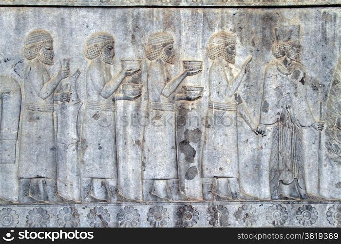 Bas-relief with ceremony on the wall of palace in Persepolis, Iran